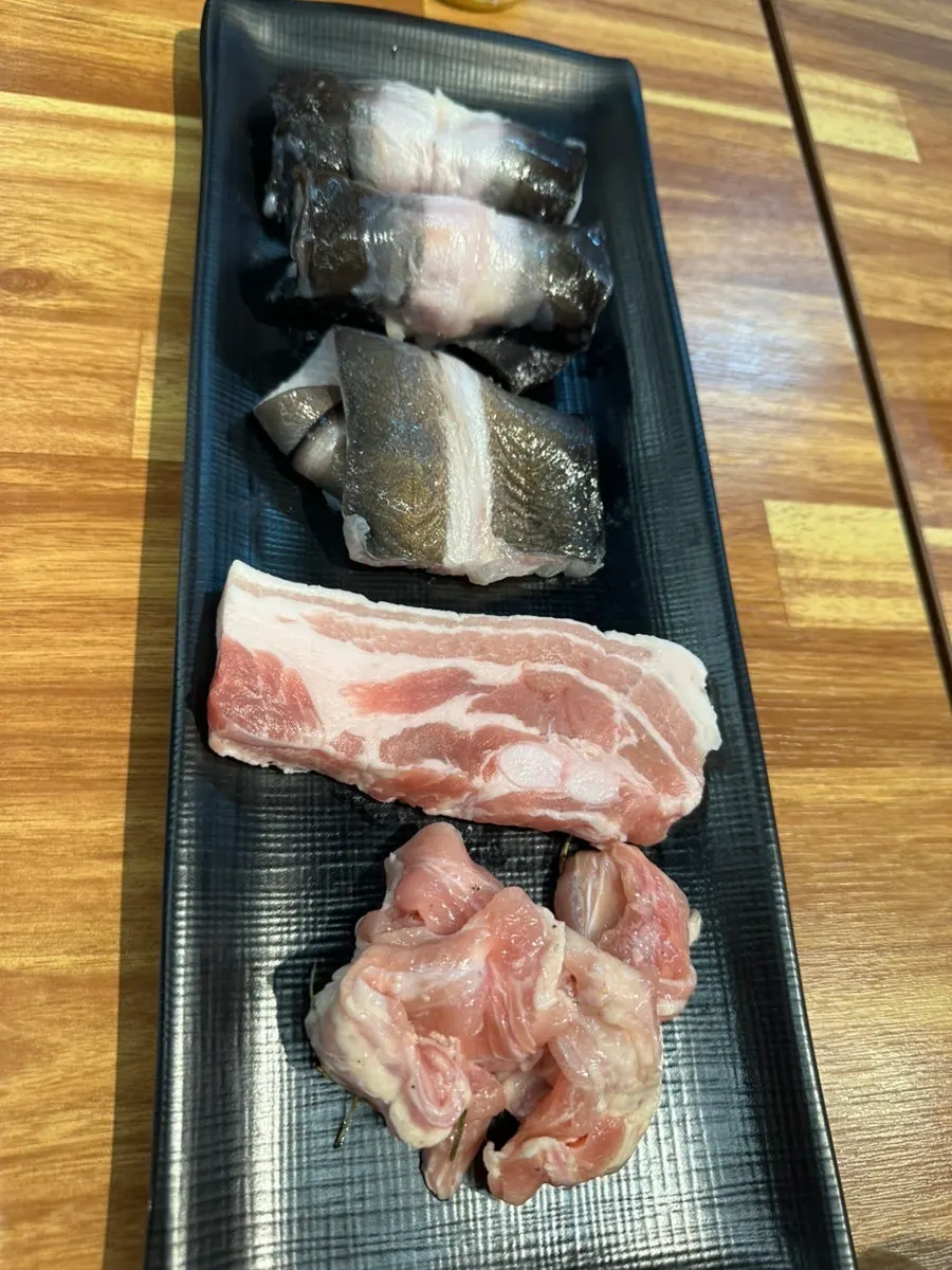 Eel side dish spread with ginger, white kimchi and green onion kimchi