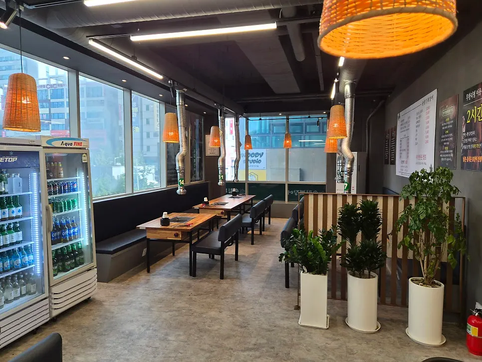 The spacious dining hall with wide table spacing at Songnim Bok Jangeo's Ansan City Hall Direct Store