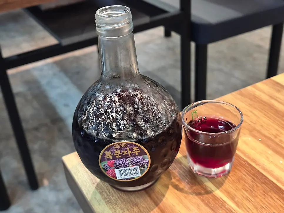 The complimentary bokbunja wine enjoyed alongside the eel