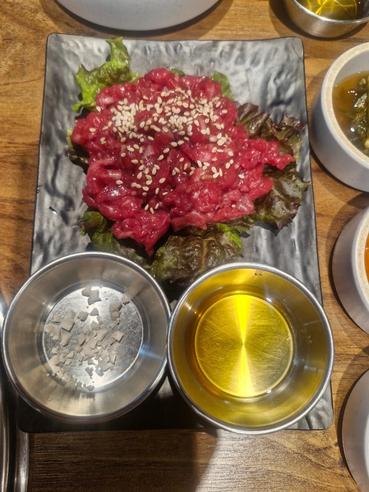 Close-up of Yangsimso LA galbi grilling over charcoal