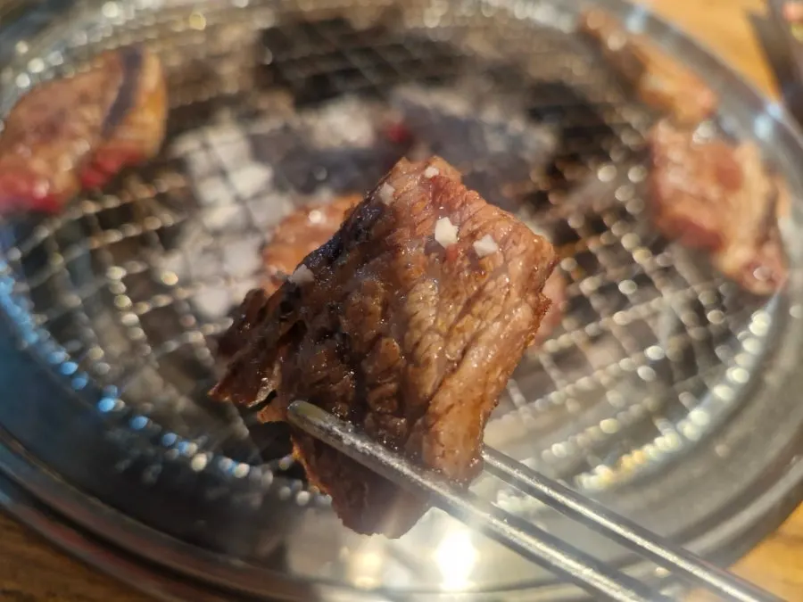 Raw LA galbi dipped in salt
