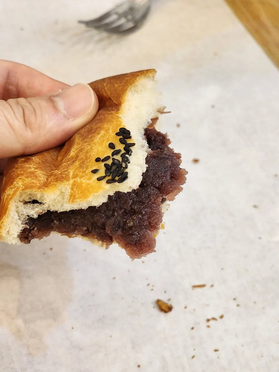 A bite taken out of the red bean bread