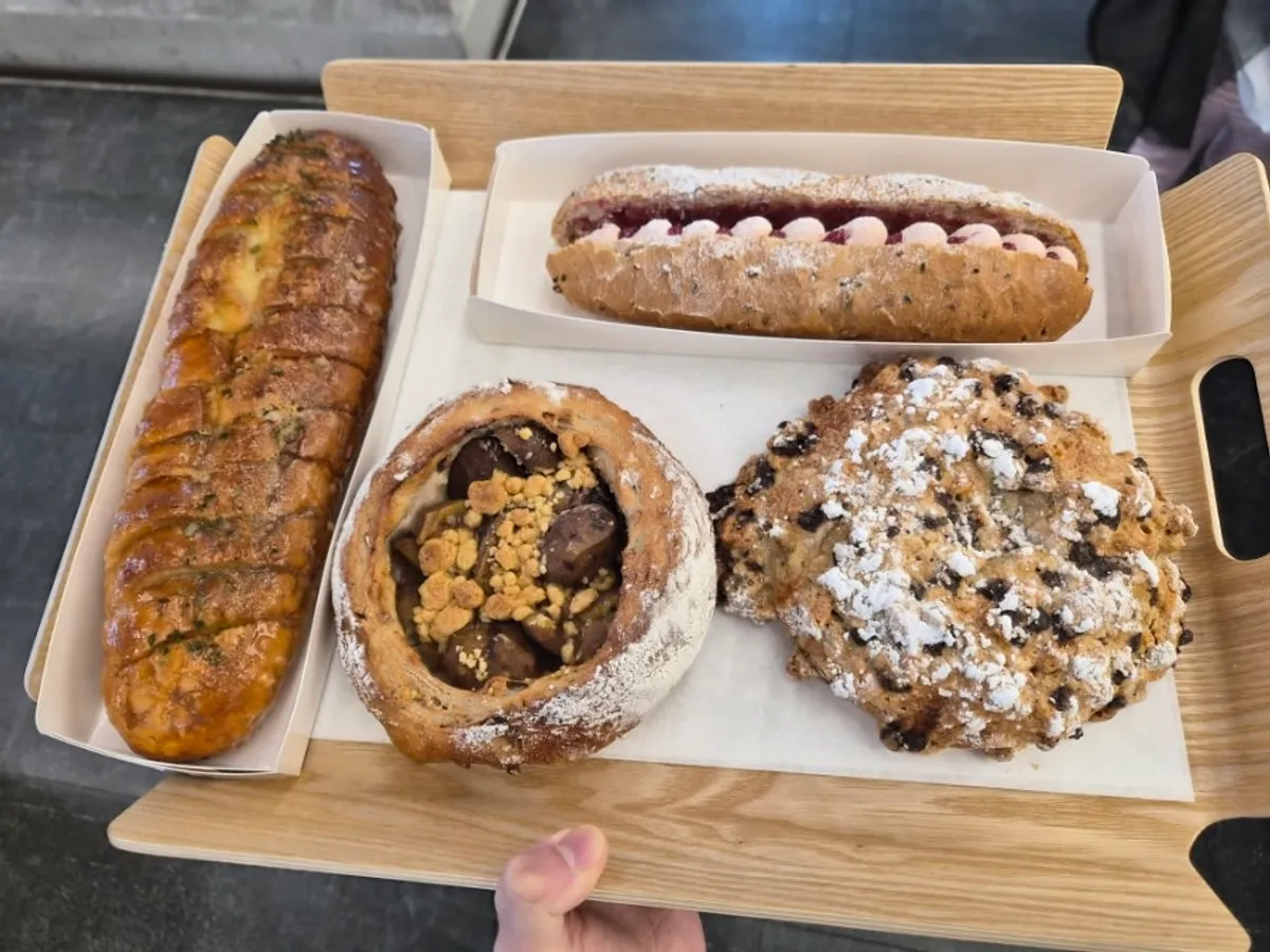 Tray with raspberry baguette and anbutter salt bread