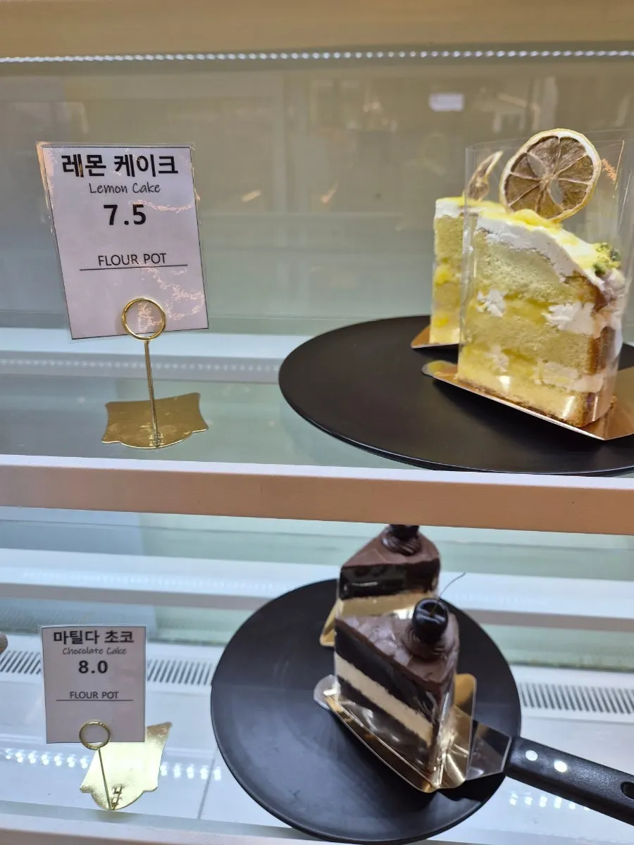 Slice cakes in the refrigerated display case
