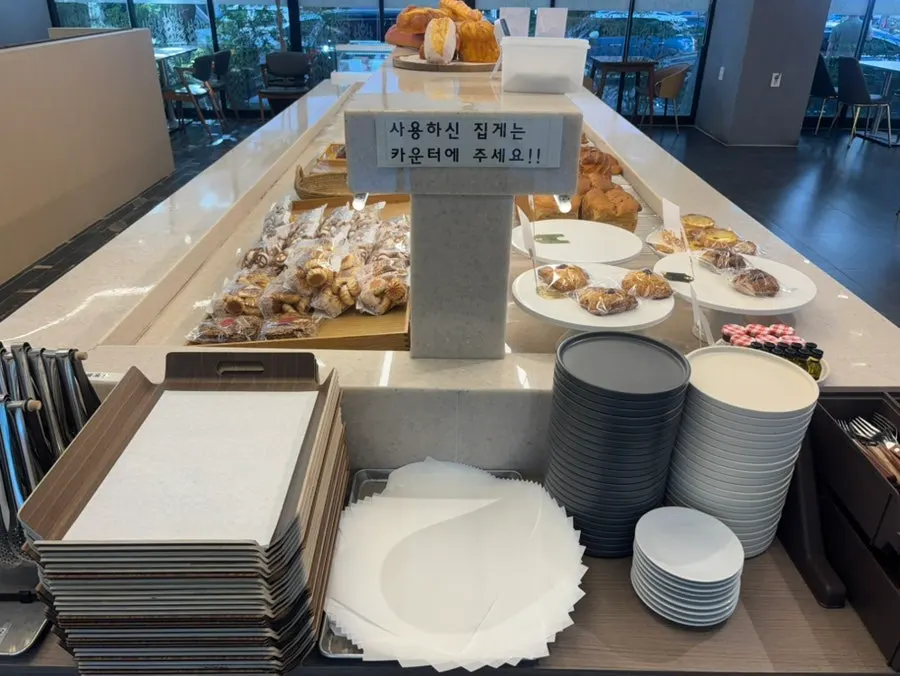 Bakery display case filled with bread at Flowerpot Cafe