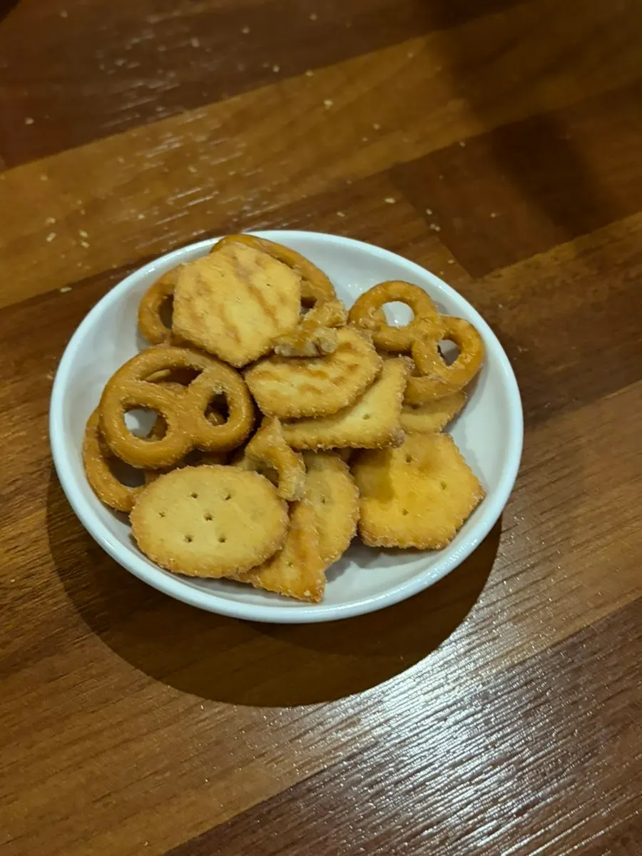 A glass of aesabi with basic snacks