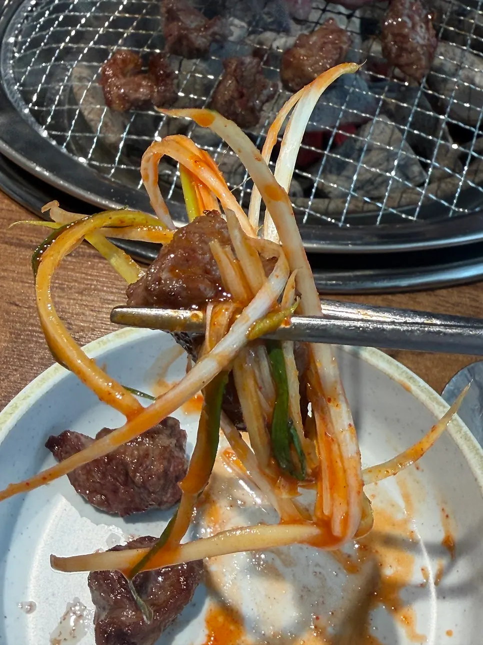 A charcoal-scented bite of beef rib meat