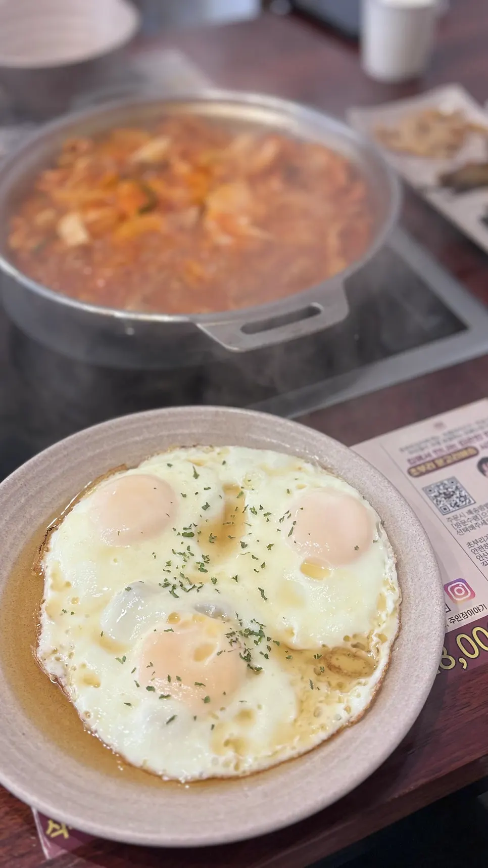 Rice and banchan laid out at the self-serve bar