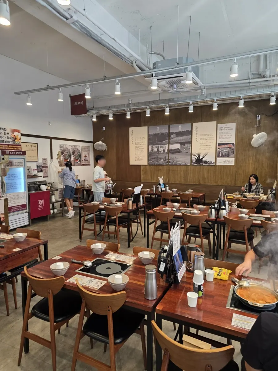 Restaurant tables set with generous spacing