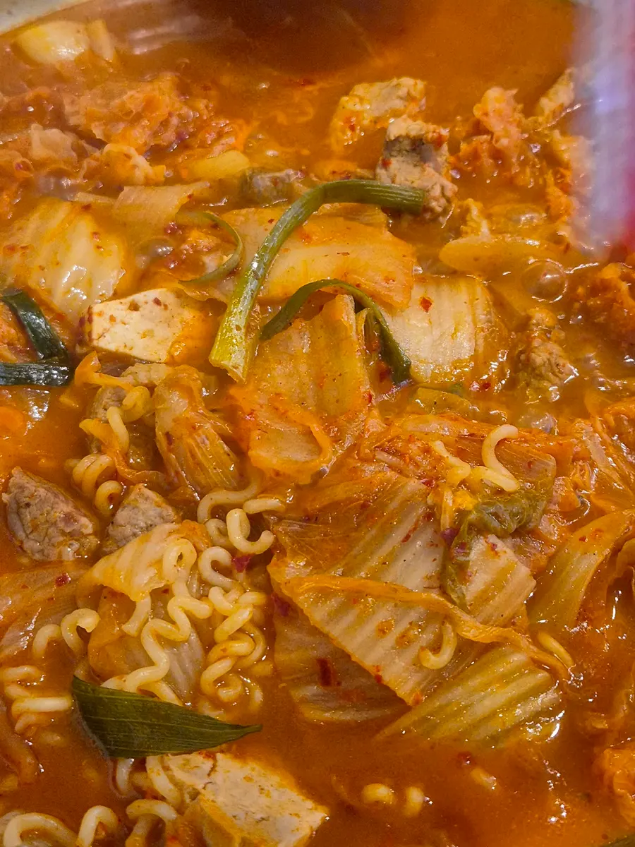 Ramyeon noodles added into the kimchi jjigae