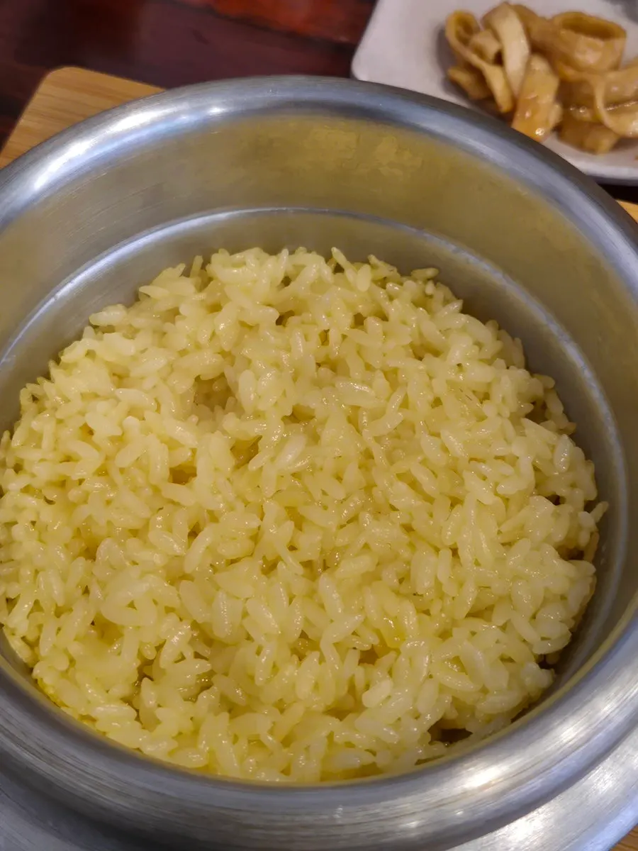 Freshly made golden gardenia stone-pot rice