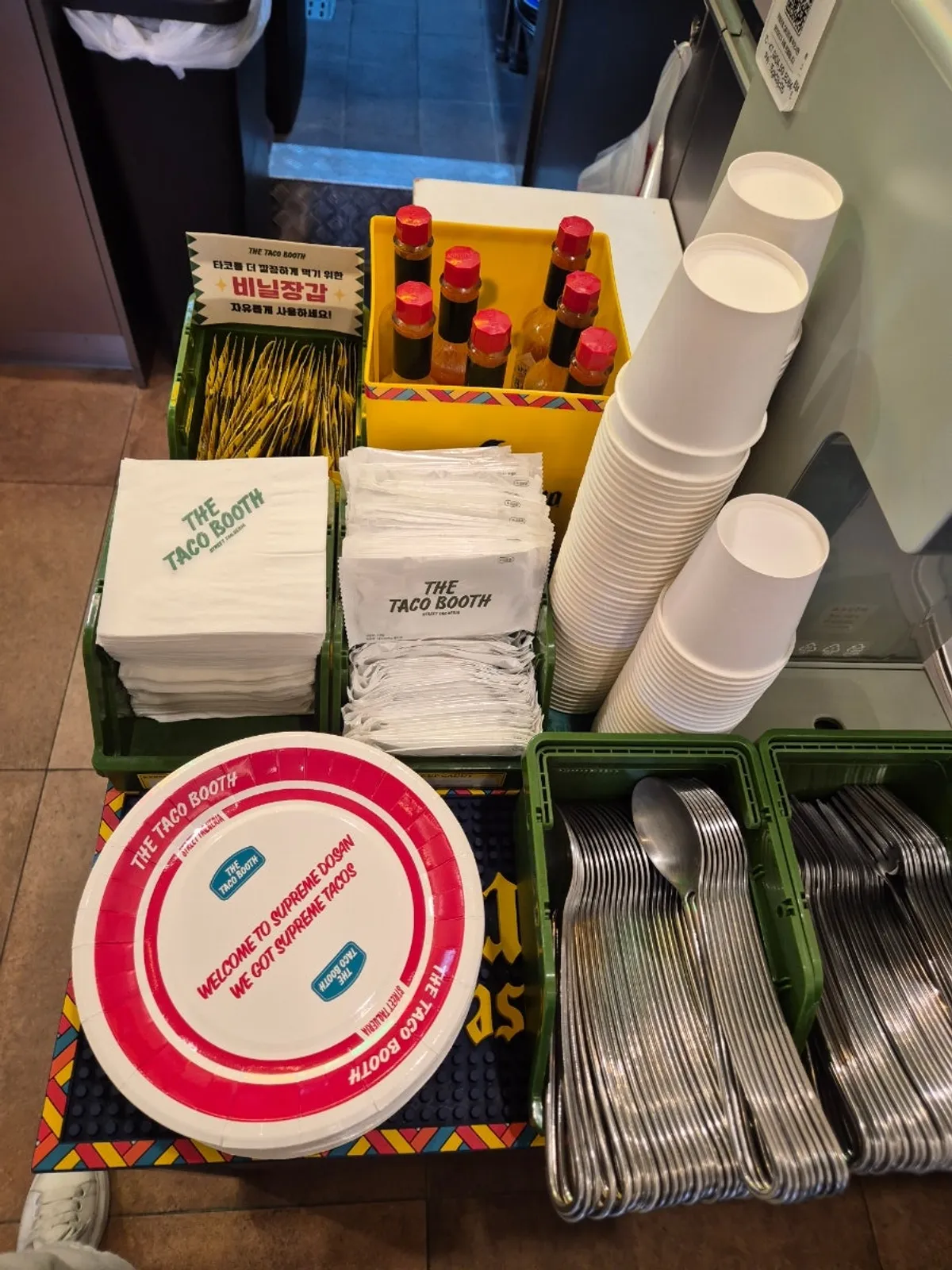 Self-serve bar with utensils and napkins