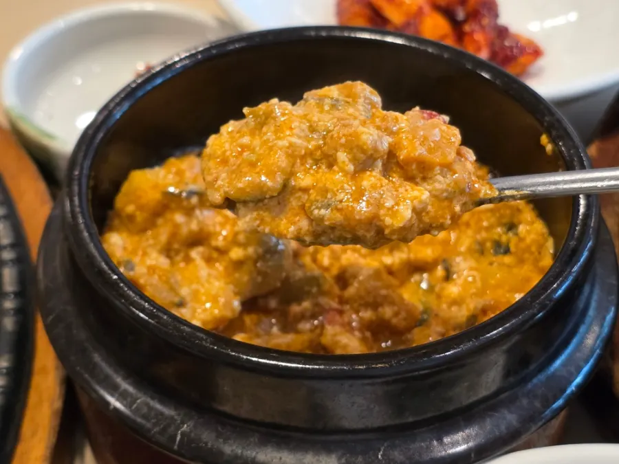 Korean meal spread with side dishes and mains
