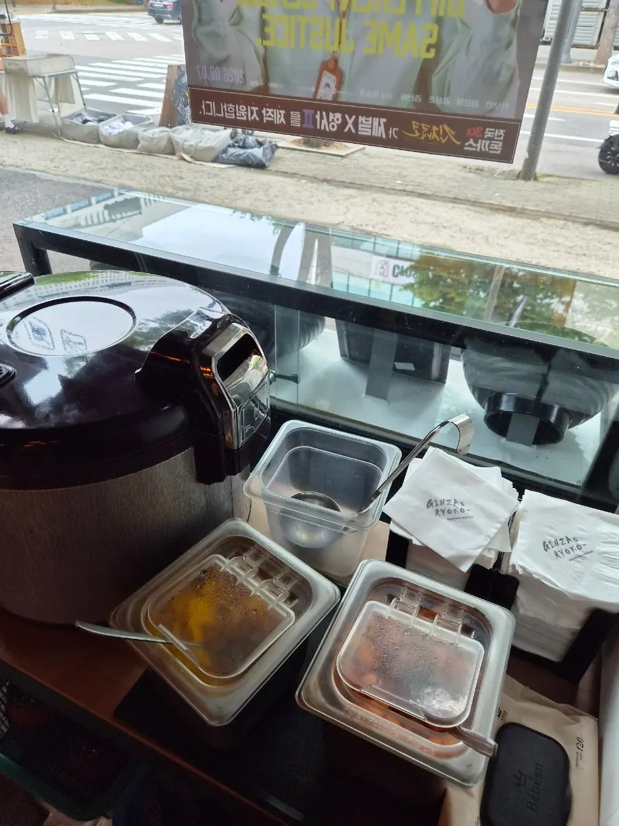 Self-service bar with soup broth, kkakdugi, and danmuji