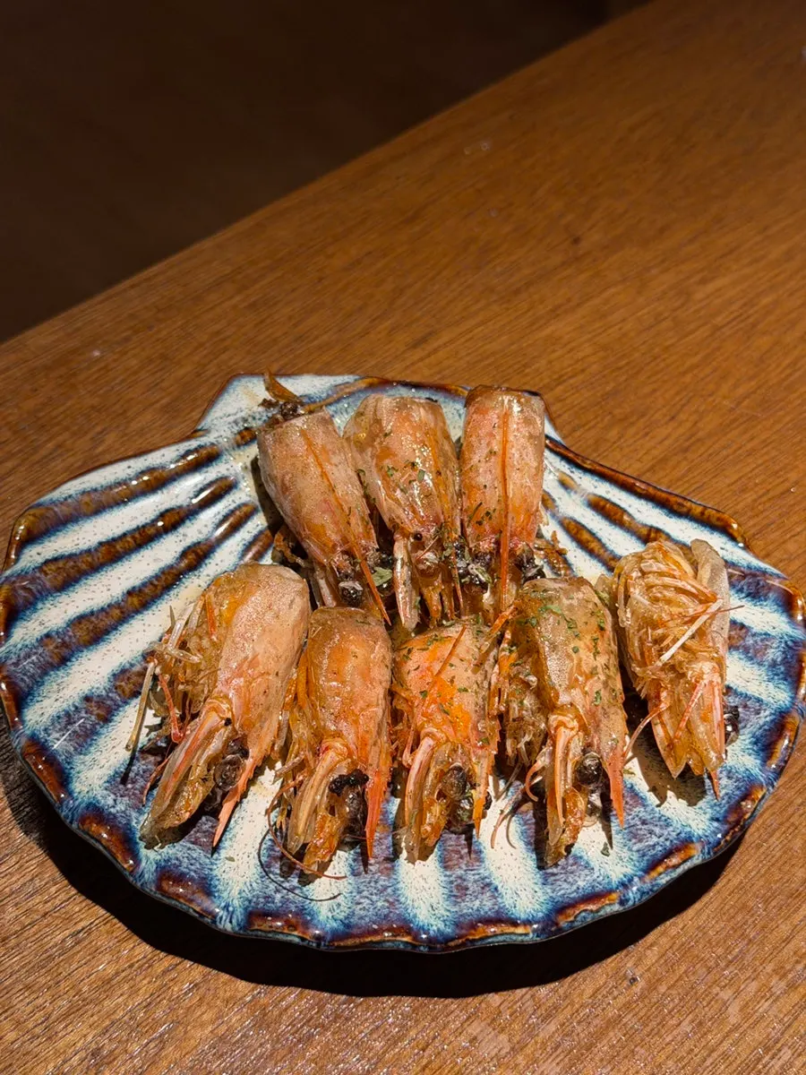 Raw shrimp sashimi with house spicy sauce
