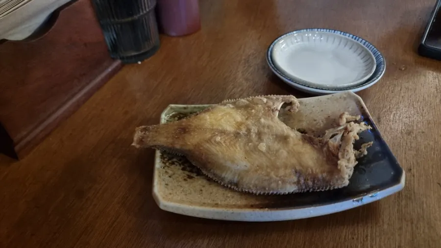 Grilled flounder served as a complimentary snack