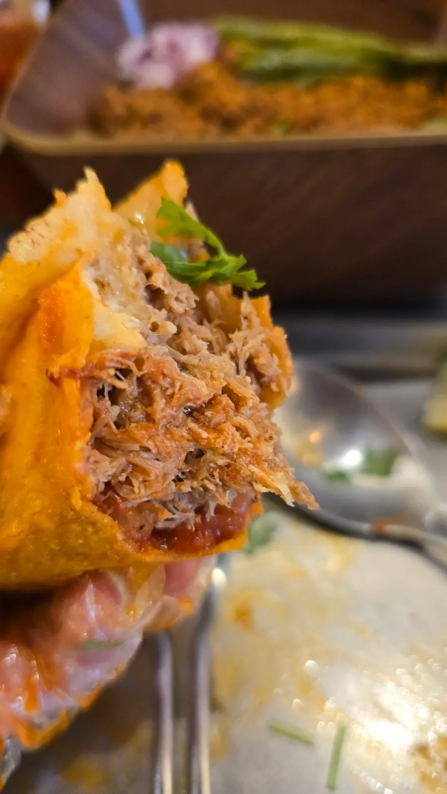 Birria taco filled with meat and cheese