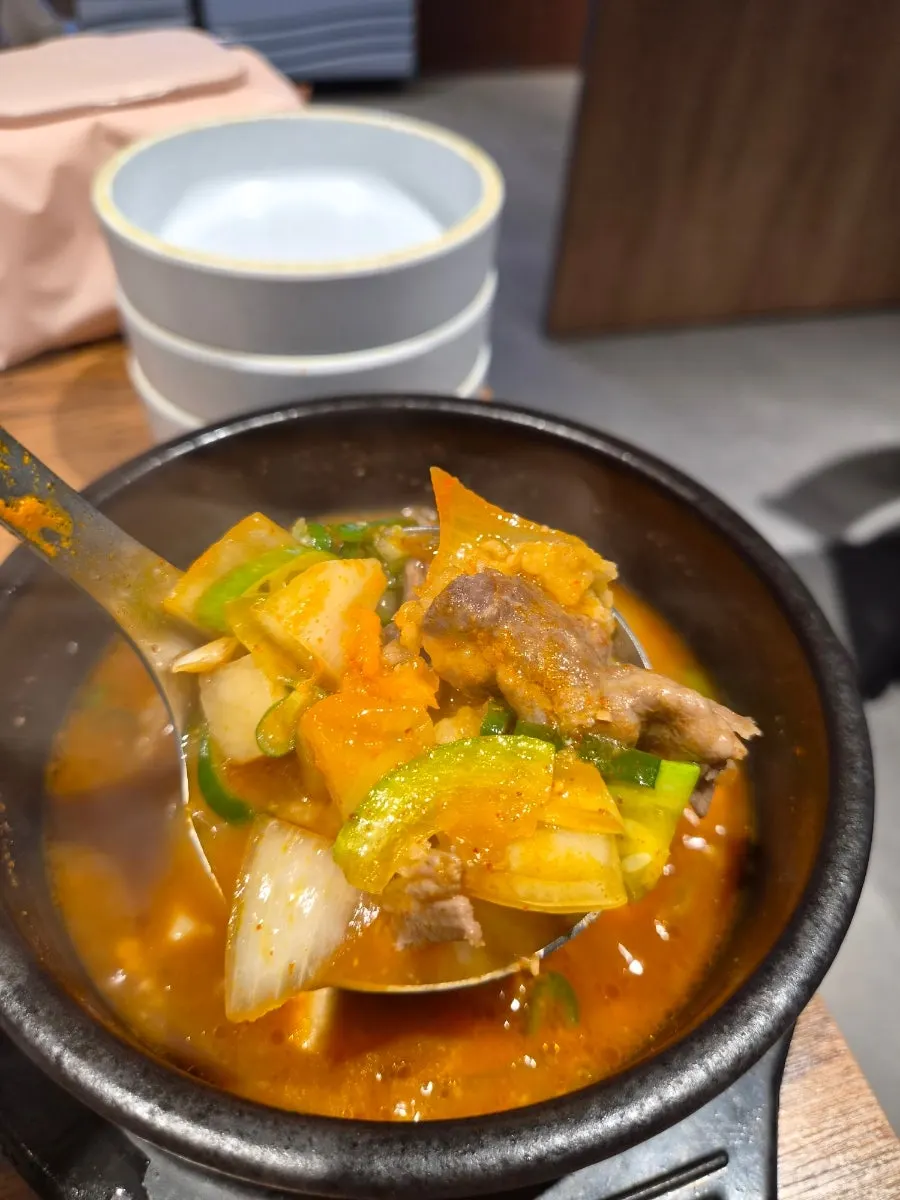 Tangy naengmyeon broth with vinegar and mustard