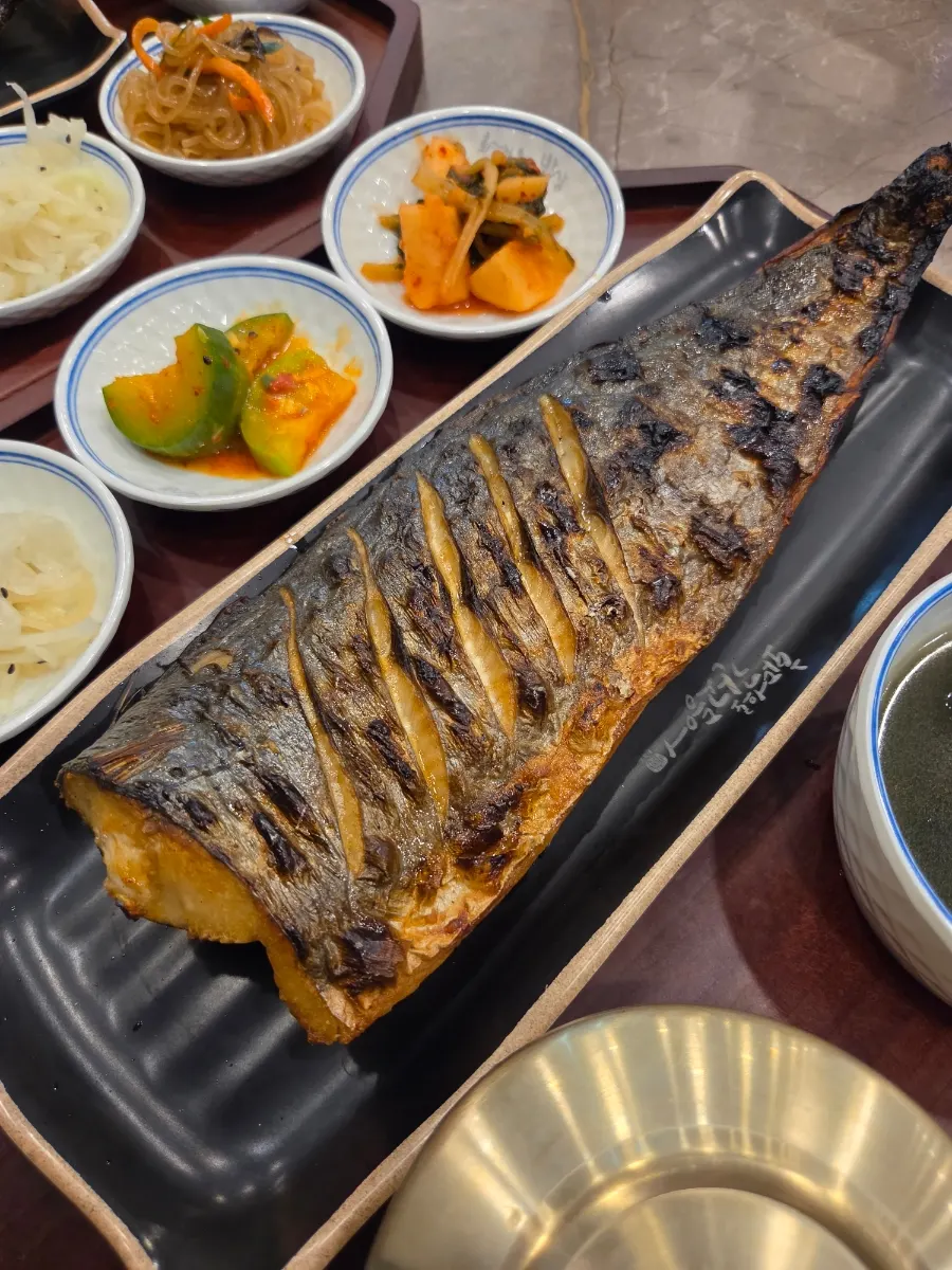 Golden-brown wood-fired grilled mackerel