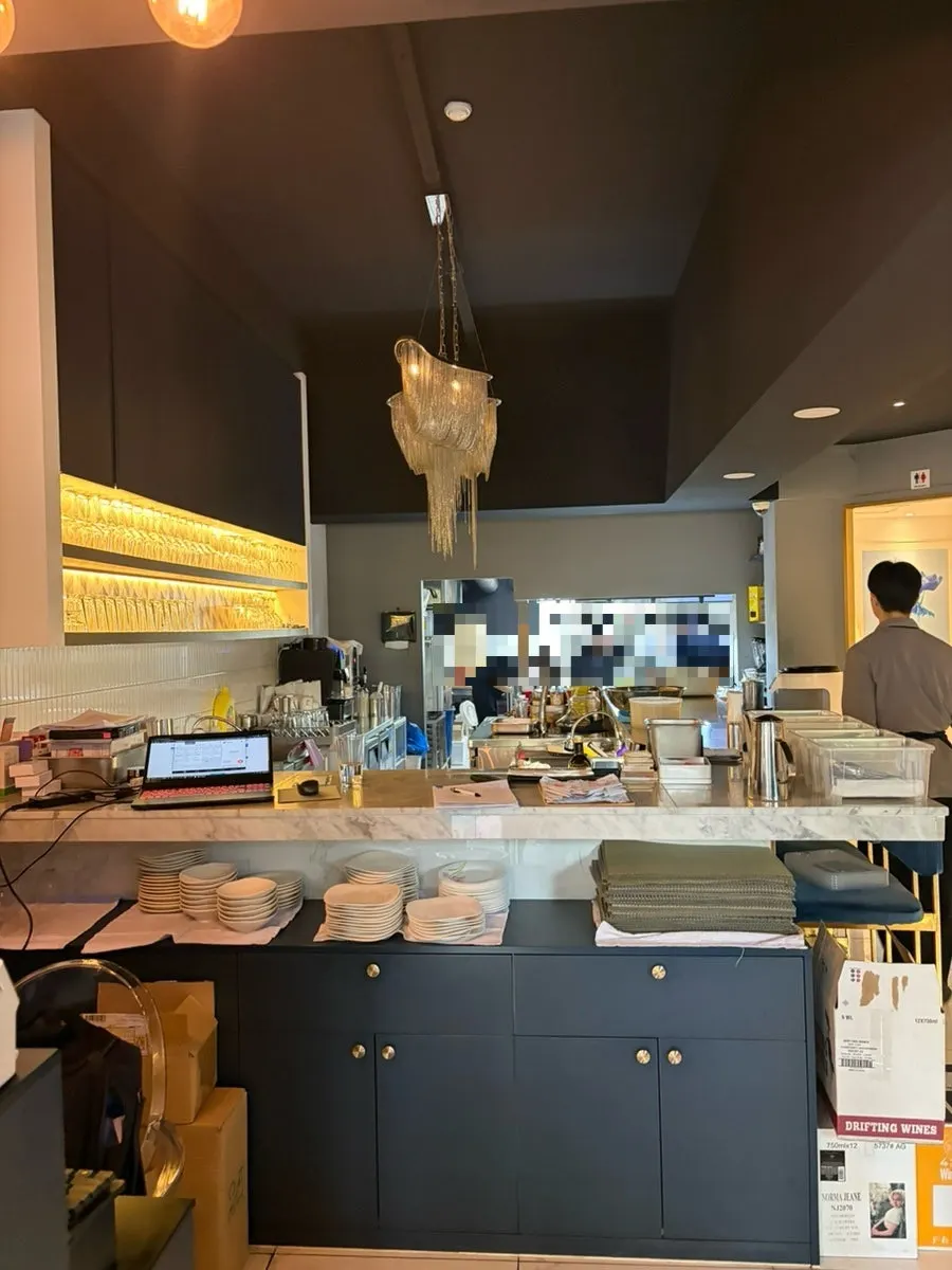 Postcard giveaway corner and restaurant interior