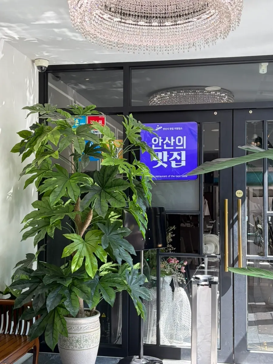 Storefront entrance with an Ansan must-eat restaurant designation mark