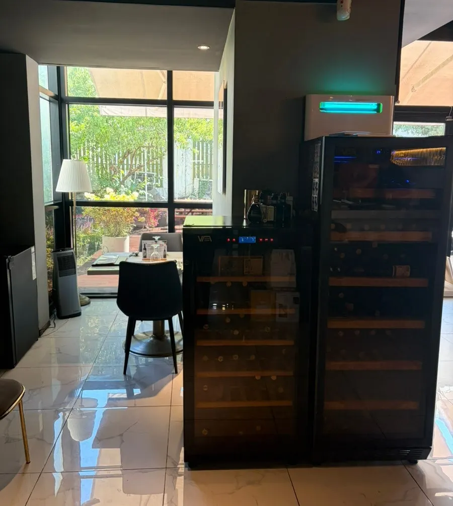 Private seating area toward the back with a wine cellar
