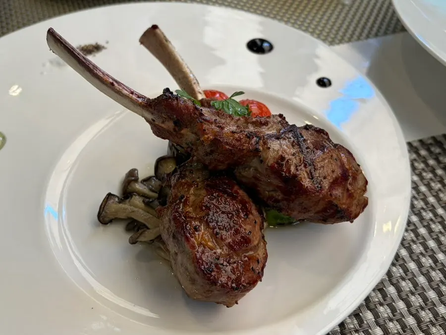 Lamb rack steak plated with garnish