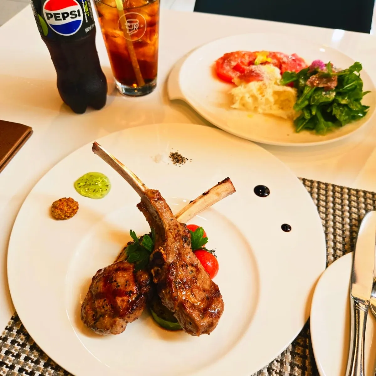Lamb chop steak and salad set at the window seat