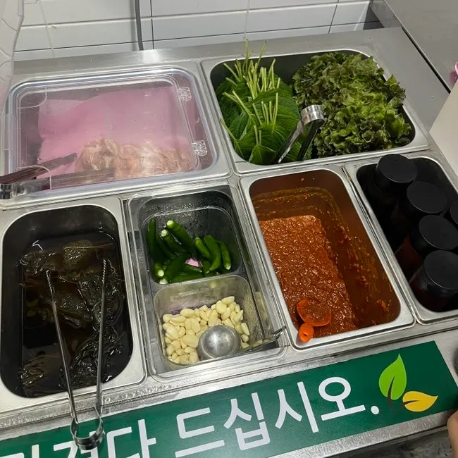 Sauces laid out at the self-serve bar
