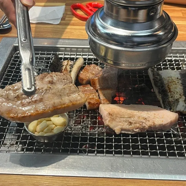 Eel and pork belly grilling on the tabletop grill