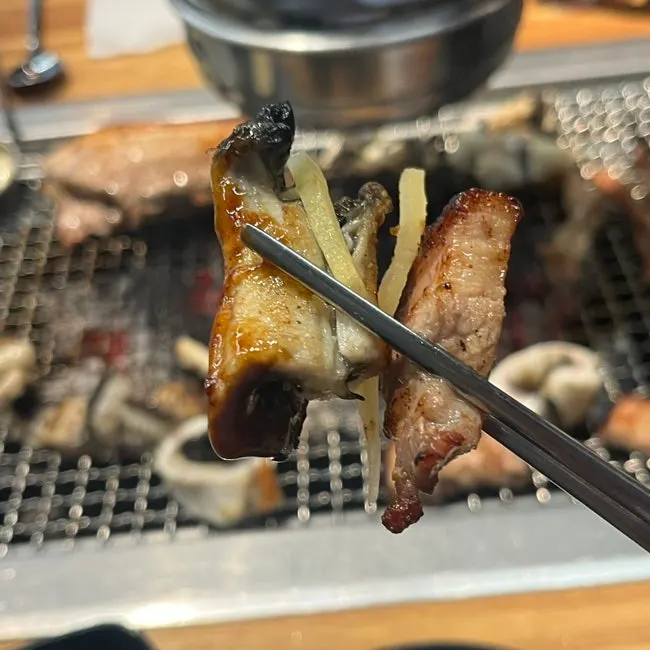 Picking up a piece of grilled eel
