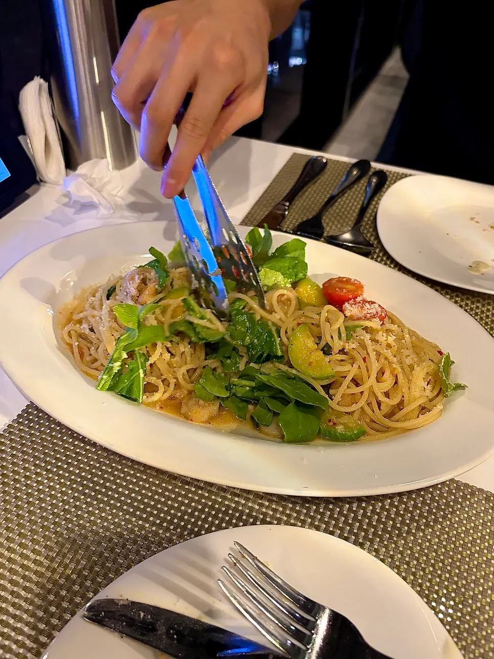 Anchovy oil spaghetti twirled on a fork