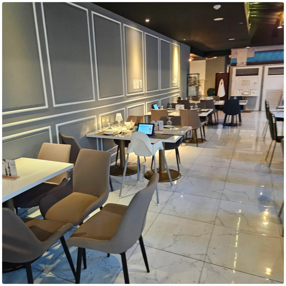 Restaurant interior with wainscoted walls and mood lighting