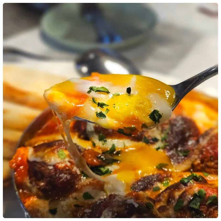 Meatball gratin served with baguette bread