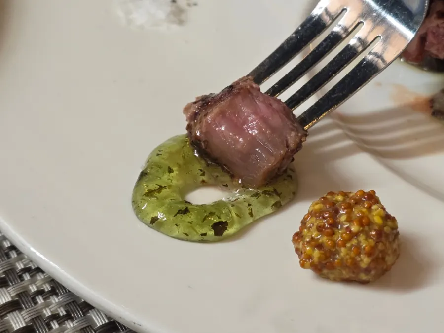 Mint jelly and other sauces served with the lamb chops