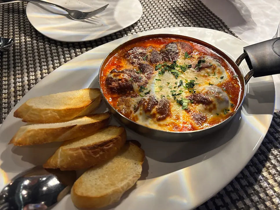 Close-up of cheesy meatball gratin