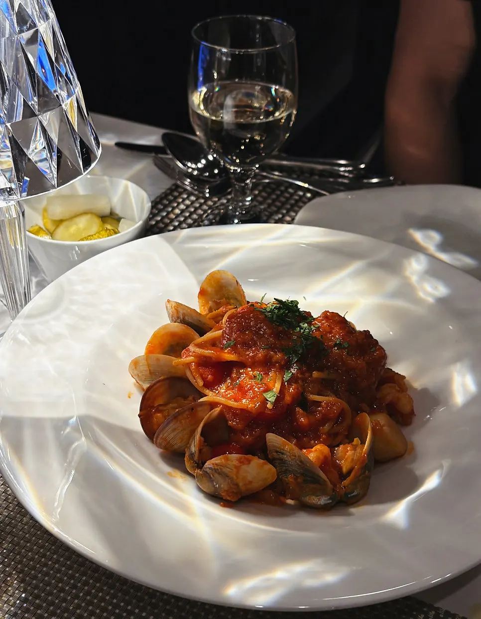 Seafood tomato spaghetti topped with clams