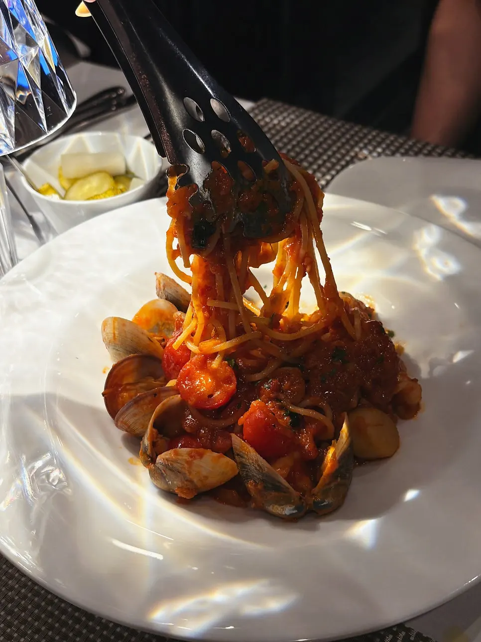 A bite of noodles mixed with sauce