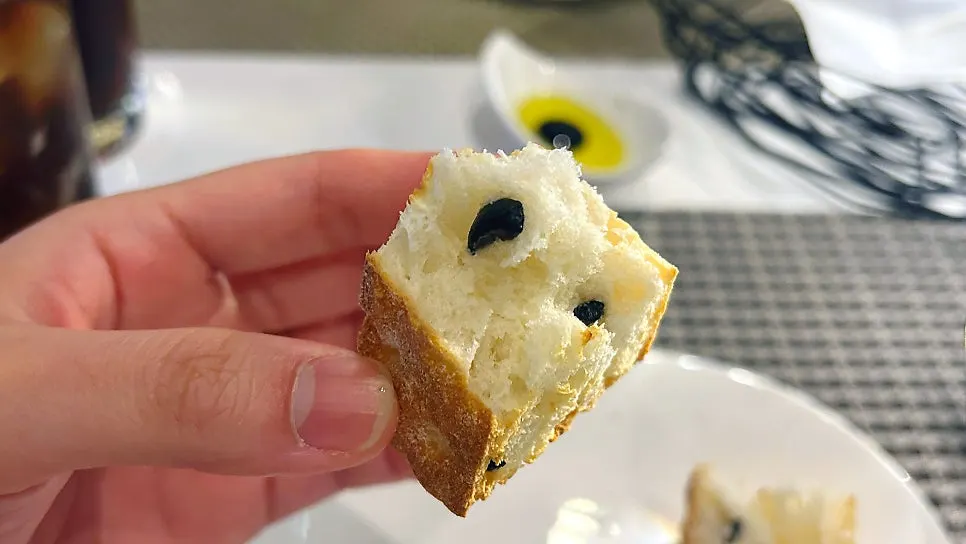 A crisply baked piece of pre-meal bread