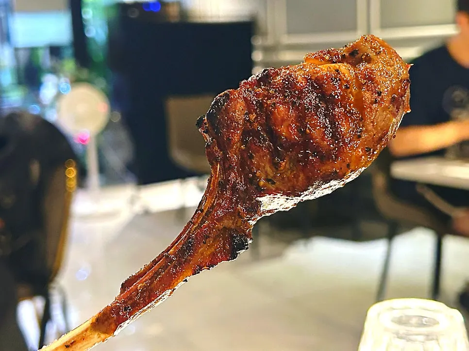 A piece of lamb chop with juices still visible