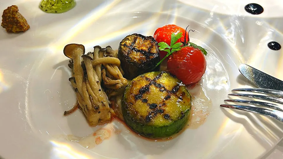 Grilled mushrooms and zucchini served alongside the lamb chops