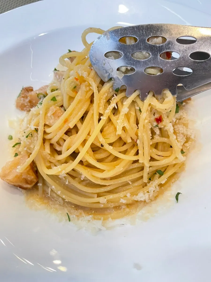 Pasta topped with roasted whole garlic cloves