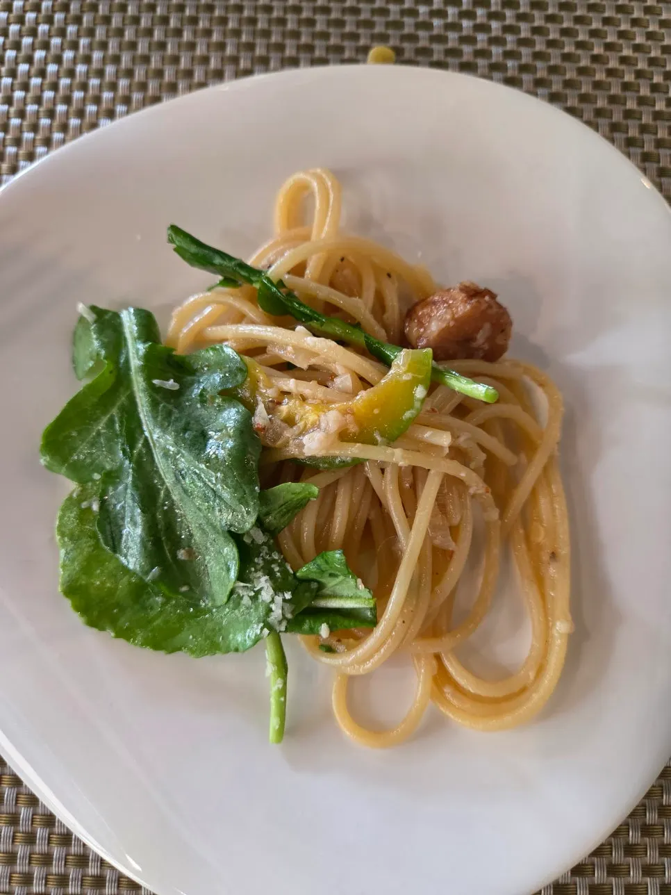 A forkful of oil spaghetti noodles lifted up