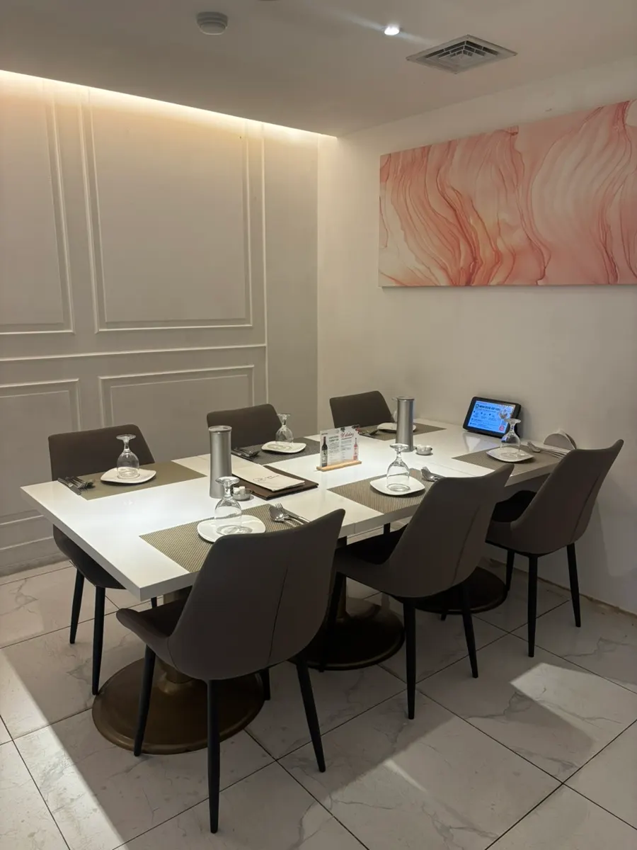Interior of the private room with wine glasses set on the table