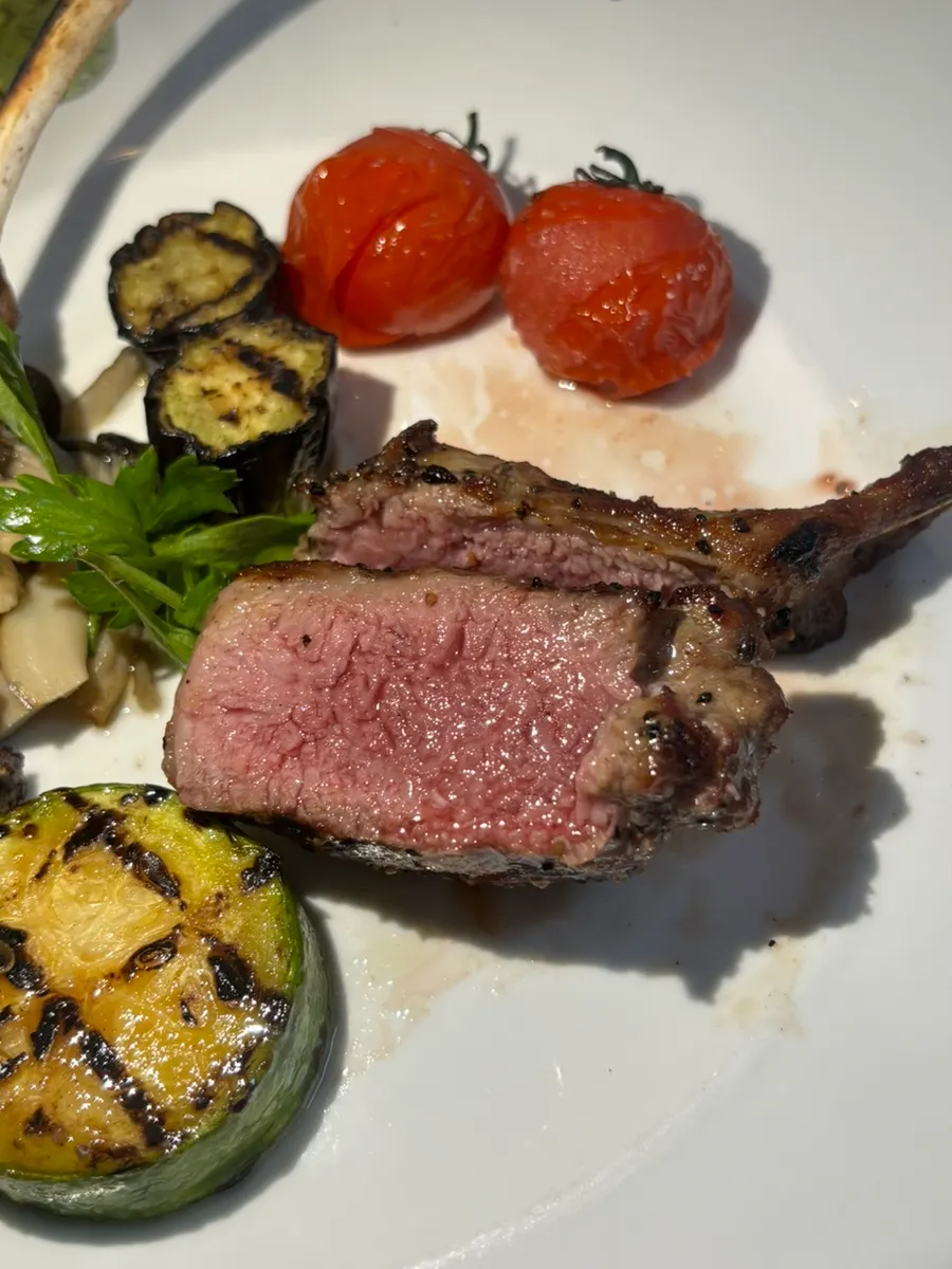 Close-up of a lamb rack seared golden brown on the outside
