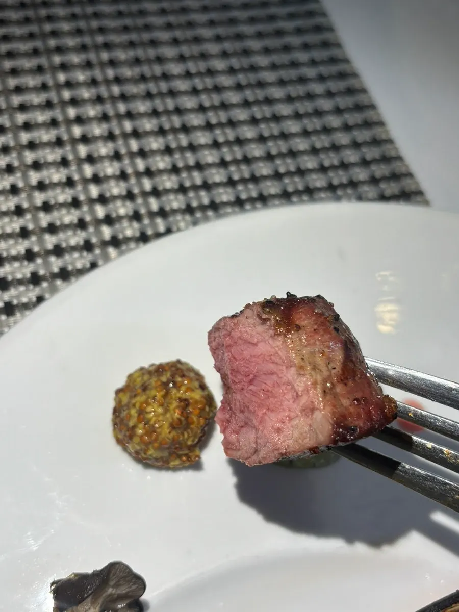 Close-up of lamb rack with grilled mushrooms