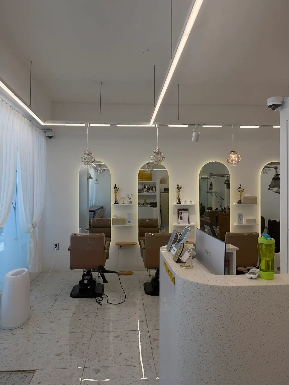 Salon with arched mirrors and lighting