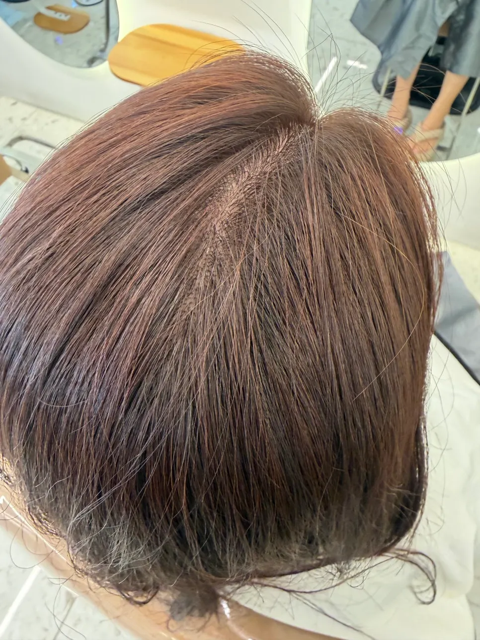 Root color result blending naturally into the hair