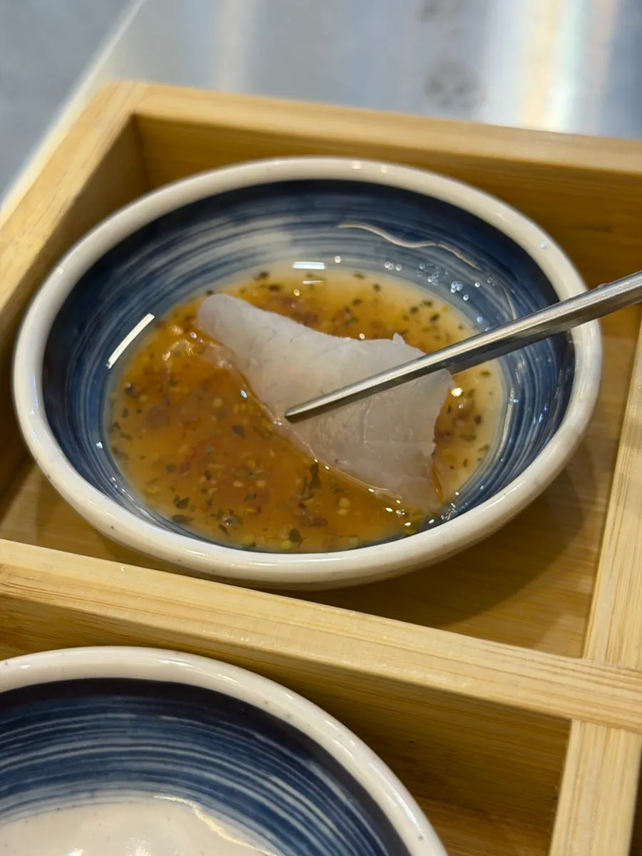 Assorted sashimi with accompanying sauces