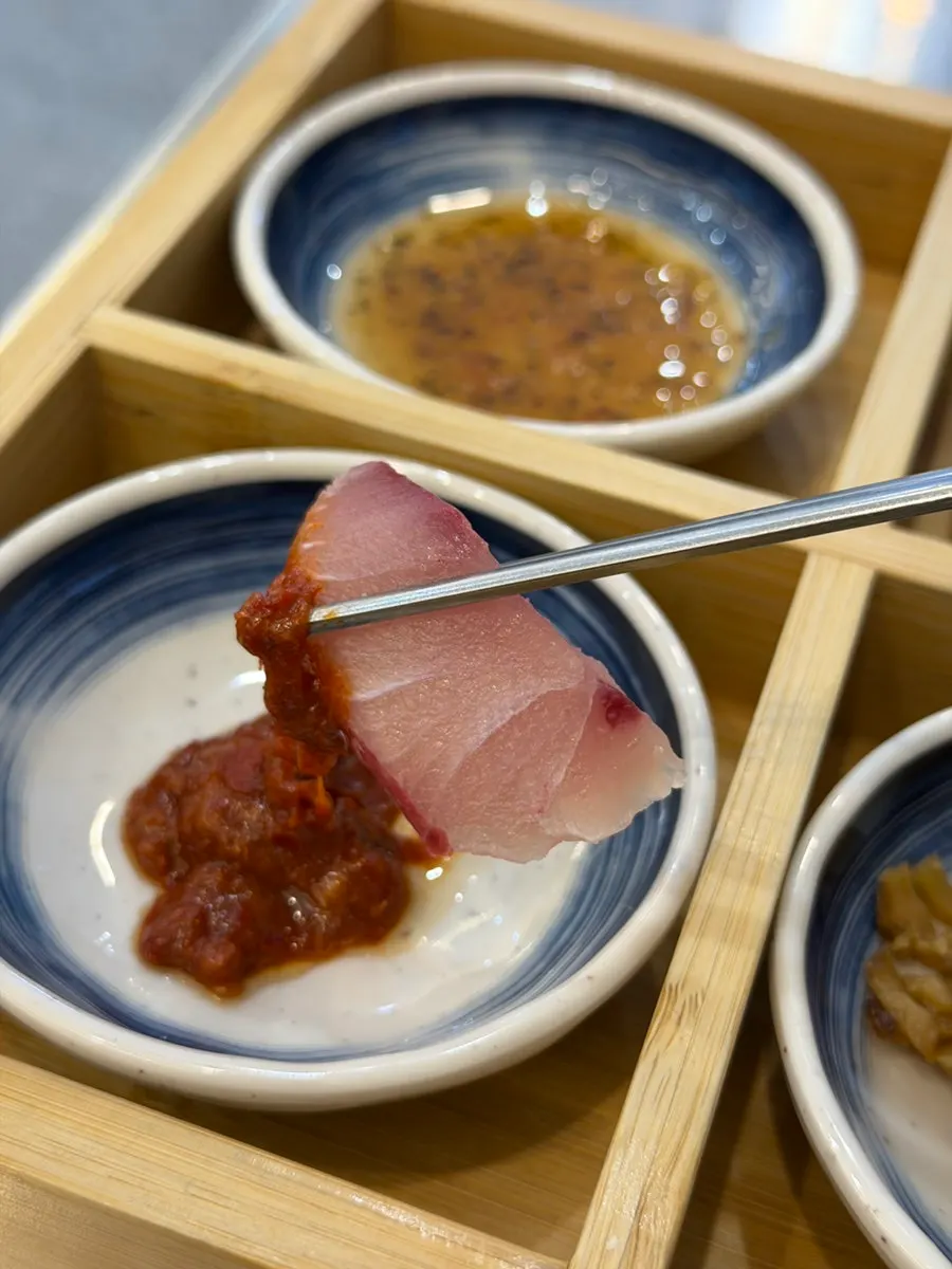 A piece of sashimi with special makjang